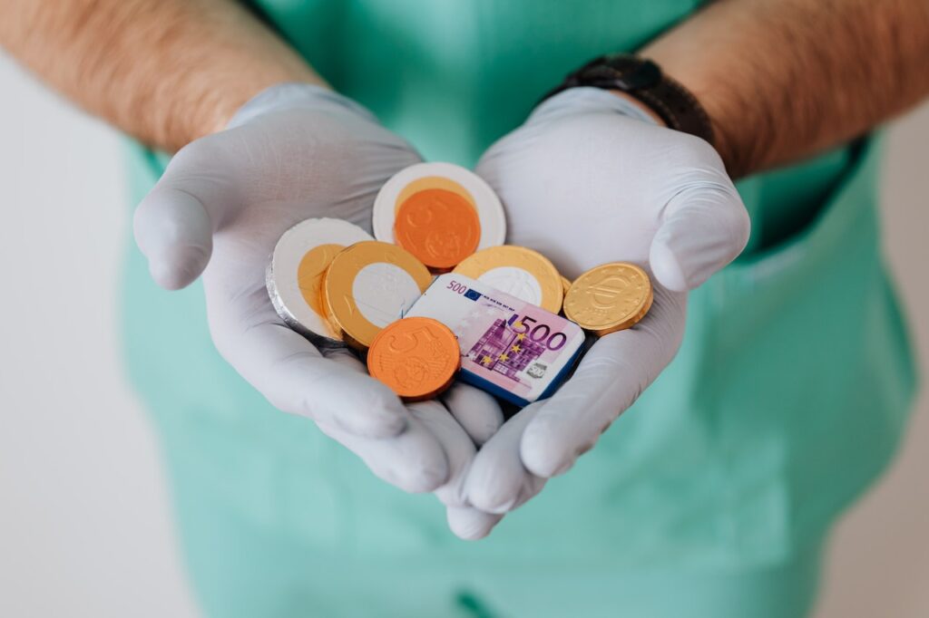 Doctor Holding Money