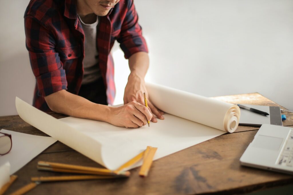 Man working on a blueprint design.